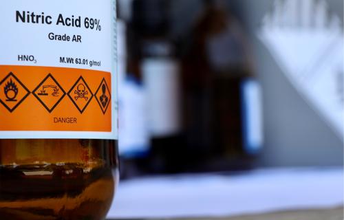 Bottle labeled Nitric Acid